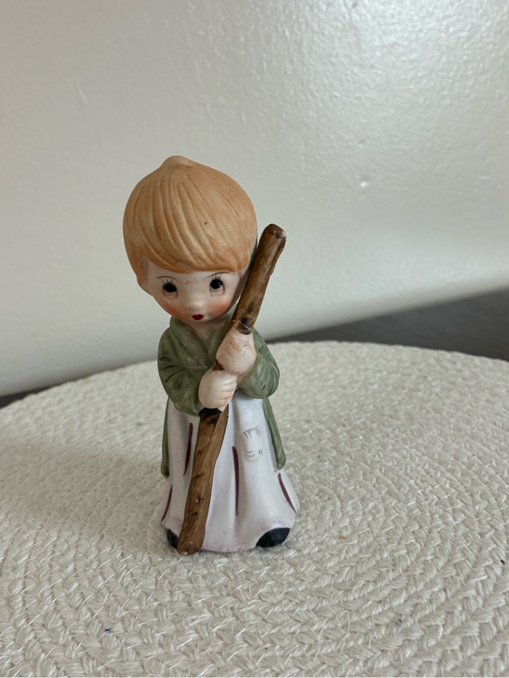 Hand-Painted Ceramic Child Figurine in Green and Cream